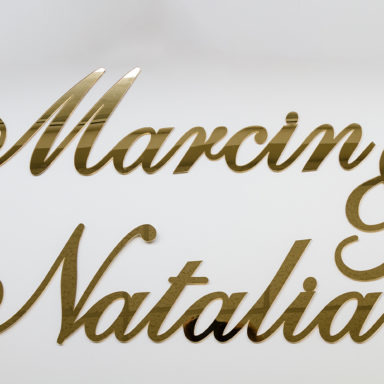 napis ze złotego lustra